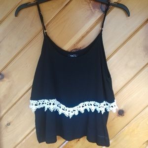 Black tank top with lace detailing.